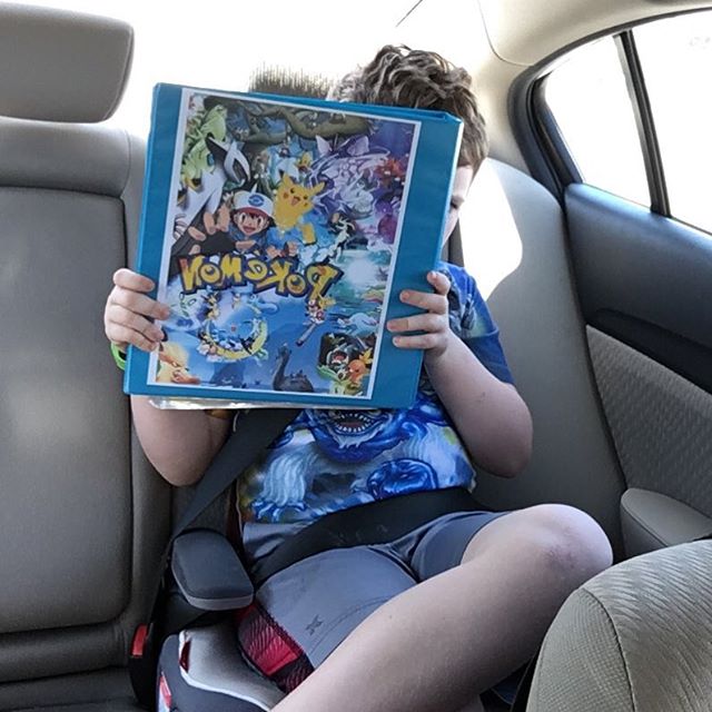 He won't go anywhere without his Pokemon binder with all of his cards.